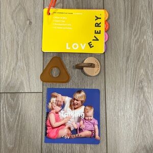 Lovevery The Charmer natural rubber teether, hand to hand discs and talking book